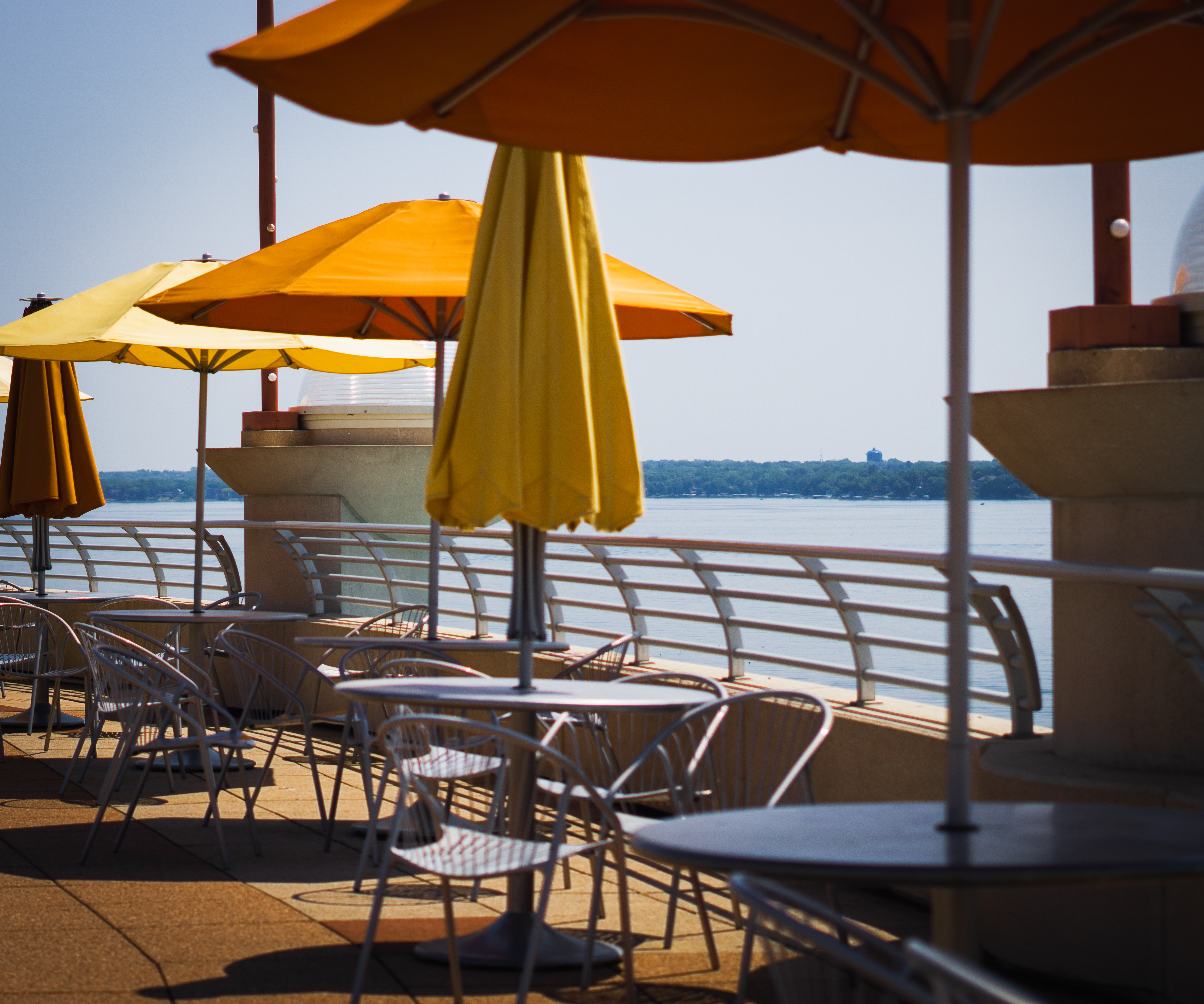 Lakeside patio with umbrellas