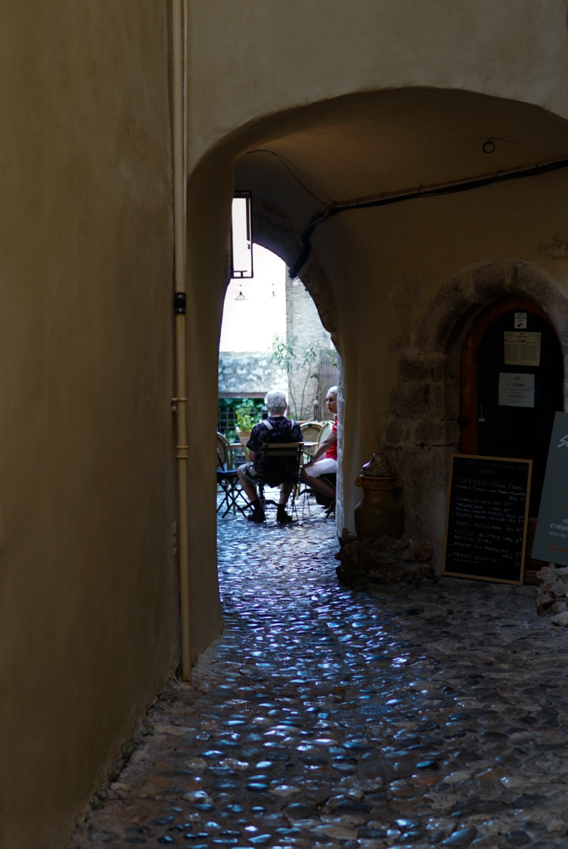 Cobblestone archway cafe